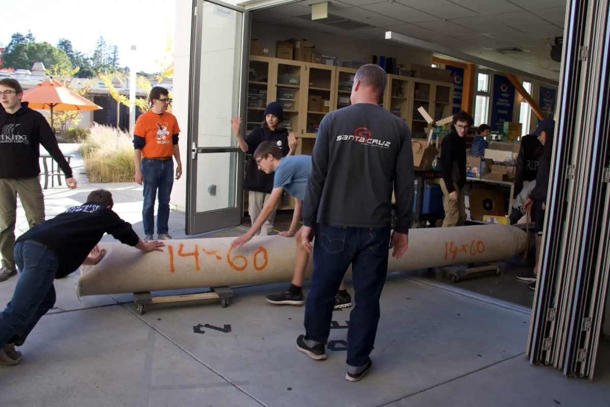 Students on Team 100 work after school in preparation for robotics competition.